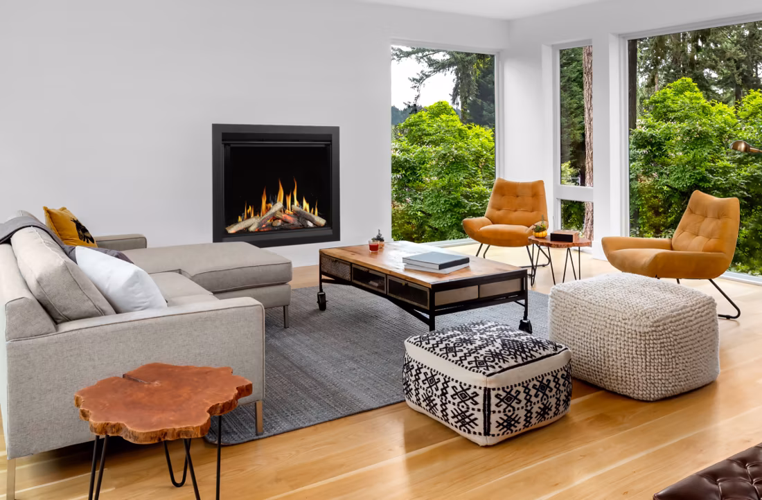 electric fireplace in bright modern living room with greenery views