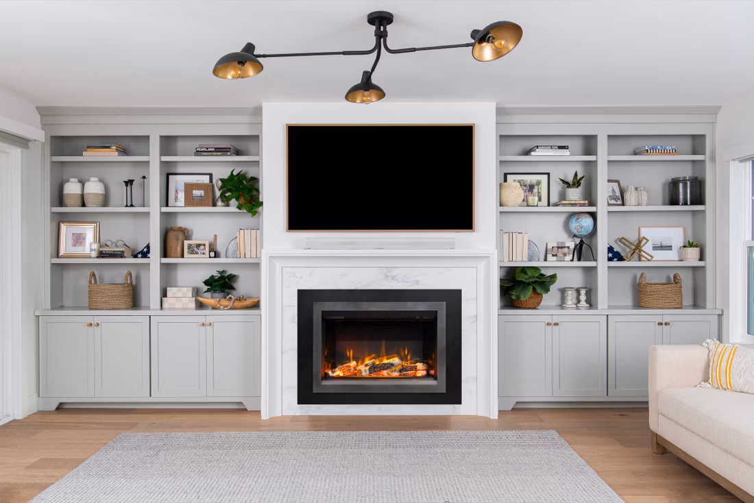 electric fireplace insert in white built-in media wall