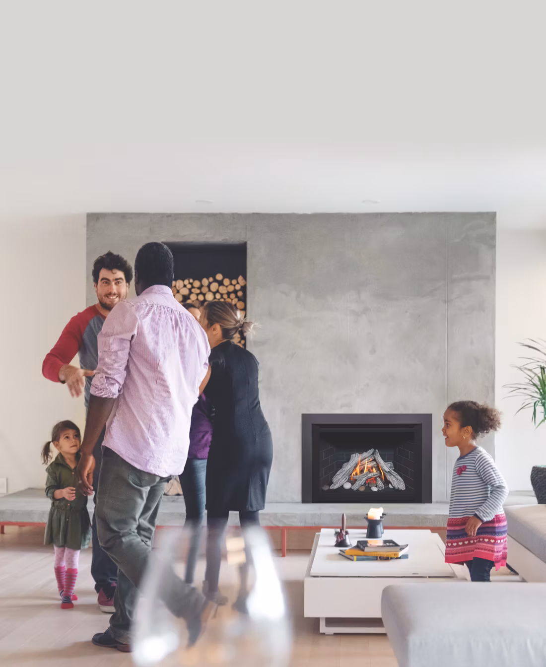 multigenerational family gathering around modern insert fireplace