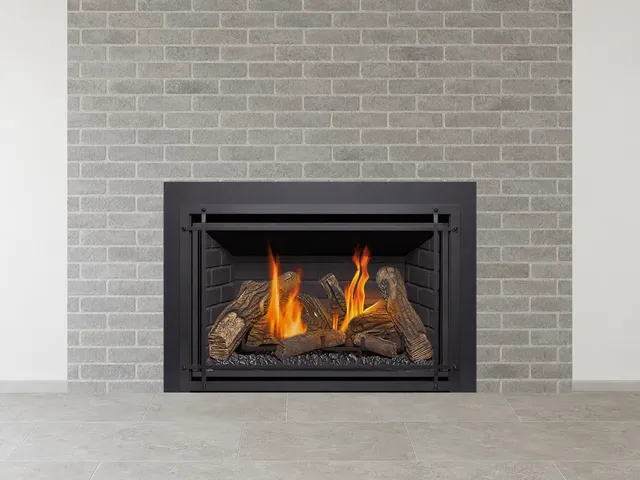 Kozy Heat Chaska 34 gas insert with a log set in a brick fireplace